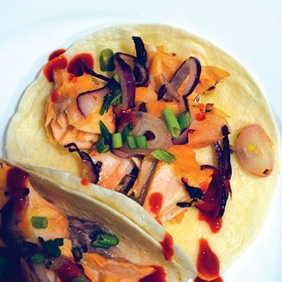 Salmon tacos with chili honey