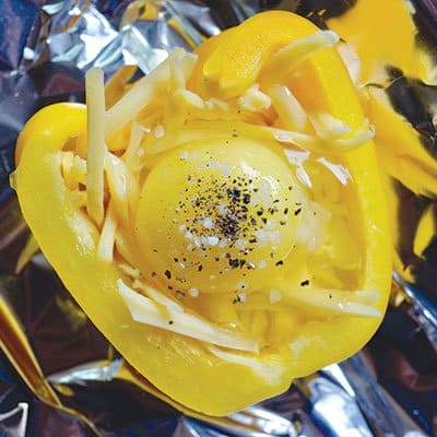 Foil-wrapped cheesy eggs in peppers
