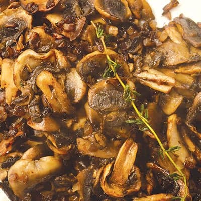 Bourbon-marinated steak with mushrooms and thyme