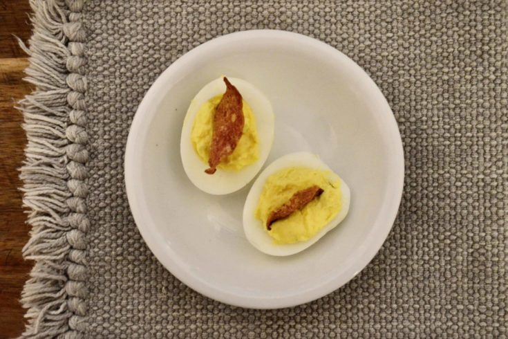 Deviled eggs with crisp salami