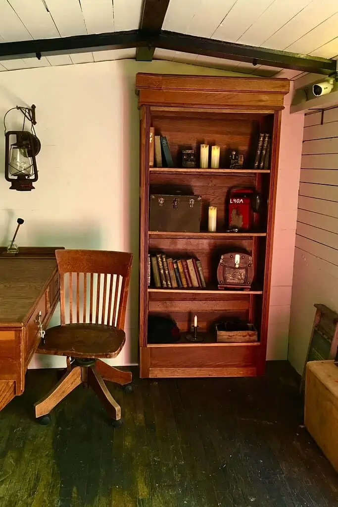 A bookcase, desk and chair