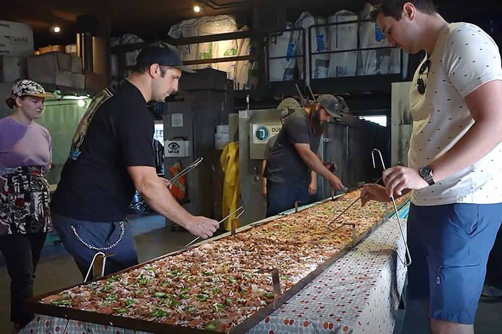 People preparing pizza