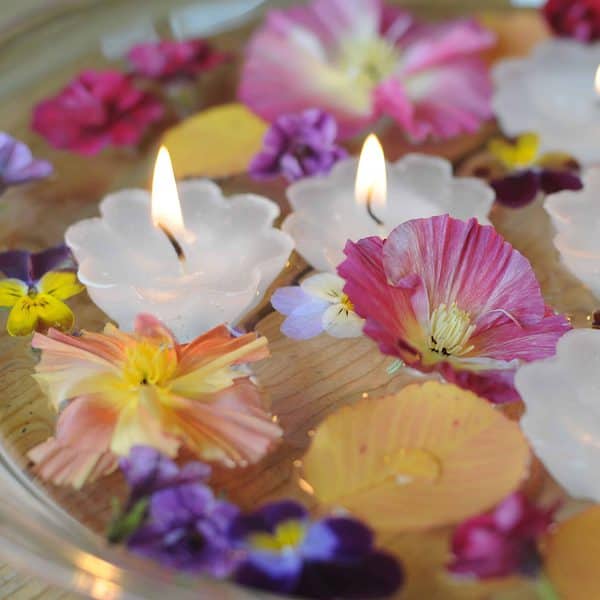 Flowers and candles floating in water