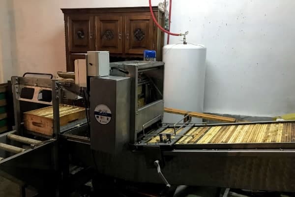 A large machine filled with raw honeycomb