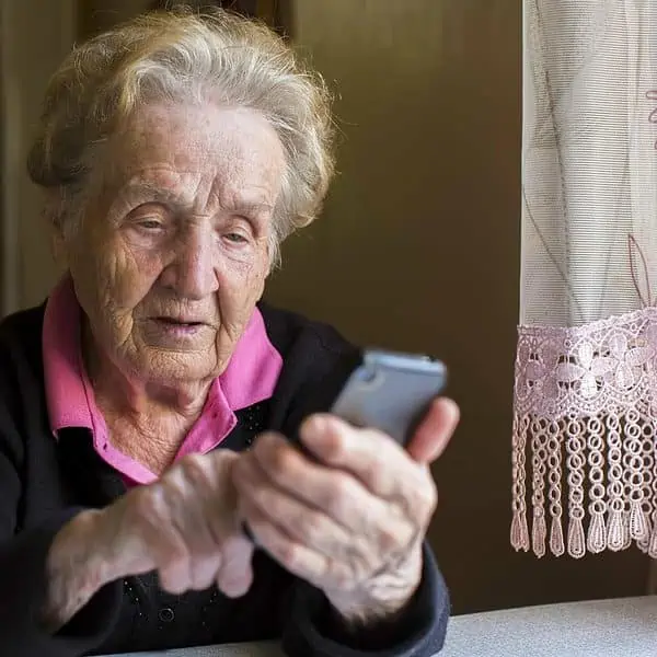 An older woman using her phone
