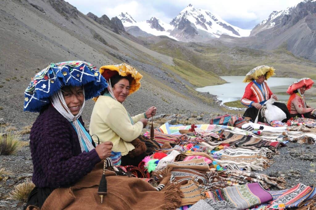 Local Andean women selling their handmade textiles