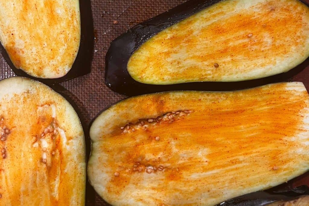 Brush the eggplant with oil and paprika