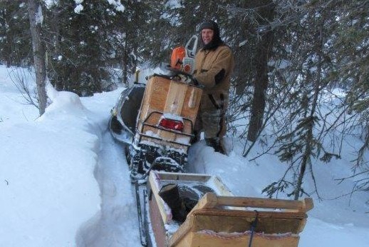 A man with a snowmobile