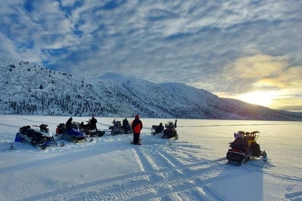 Snowmobiles on a frozen lake