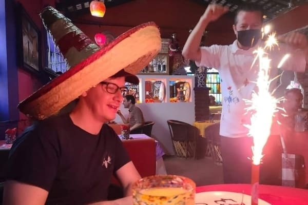 A man celebrates his birthday at a Mexican restaurant