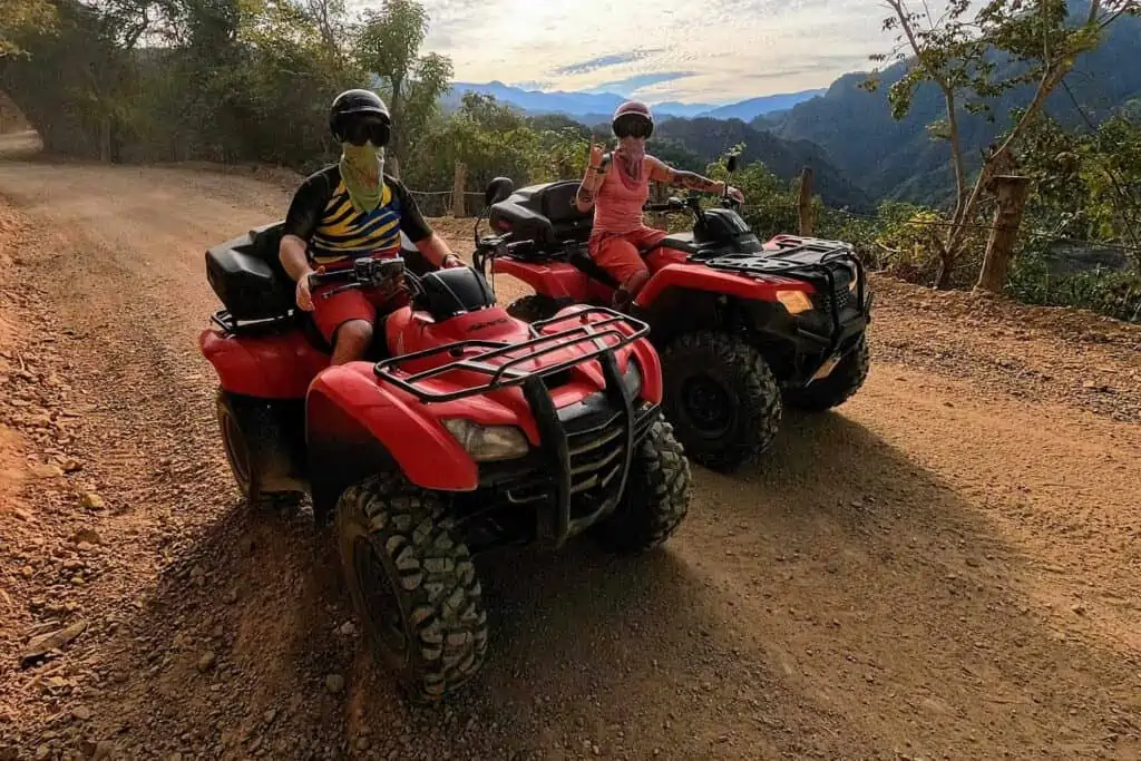 Two people on ATVs