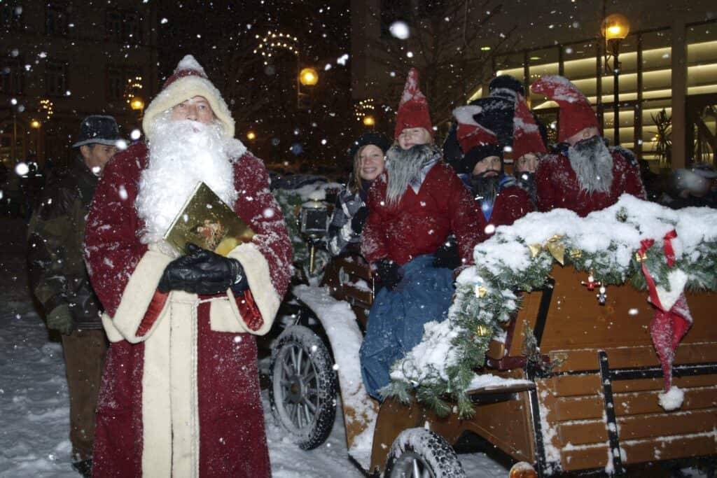 Santa Claus coming to town with a horse carriage