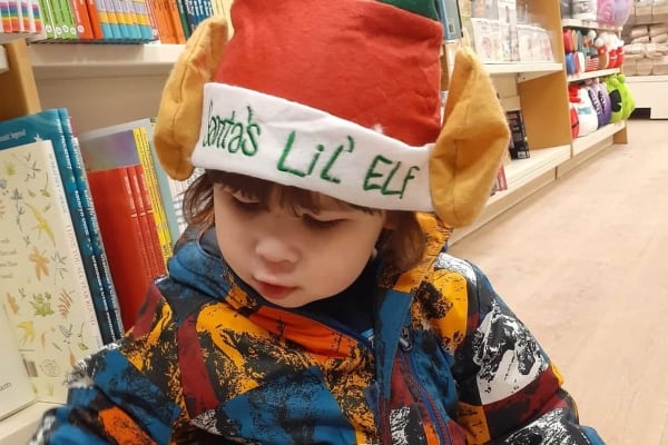 A child in an elf hat