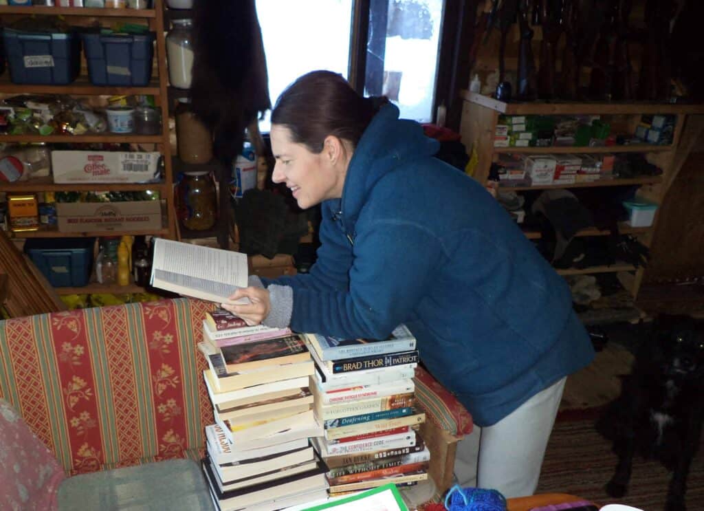 A woman with a stack of books