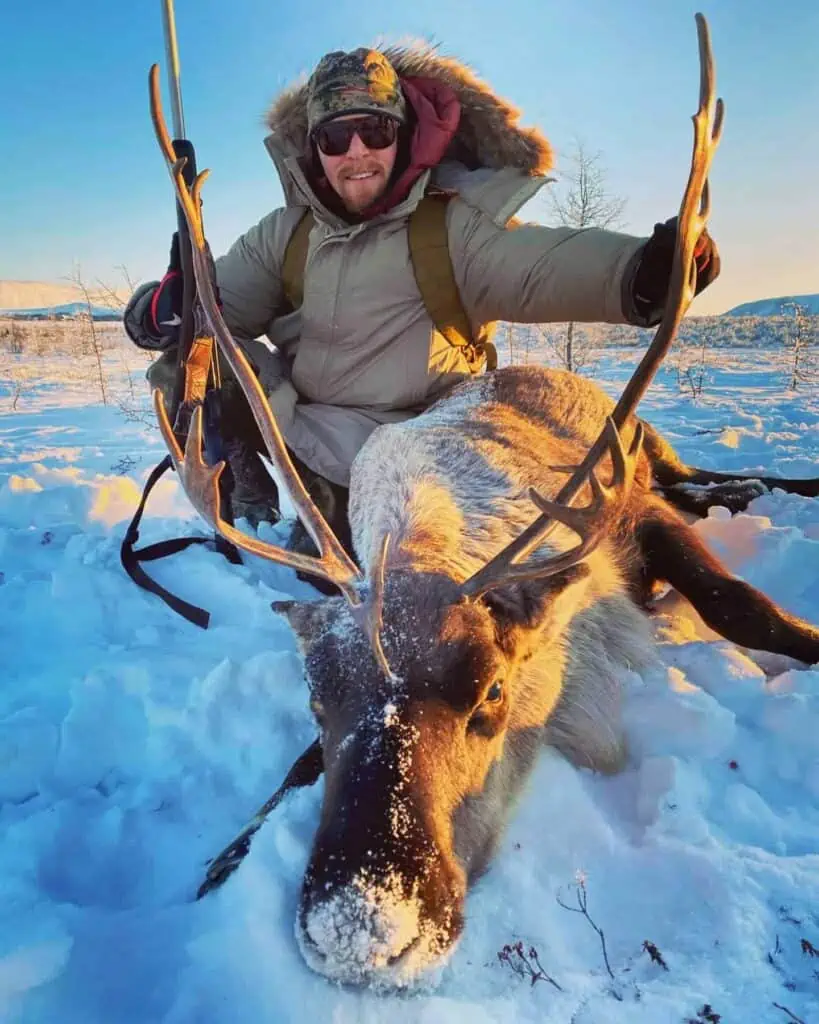 A hunter with a caribou