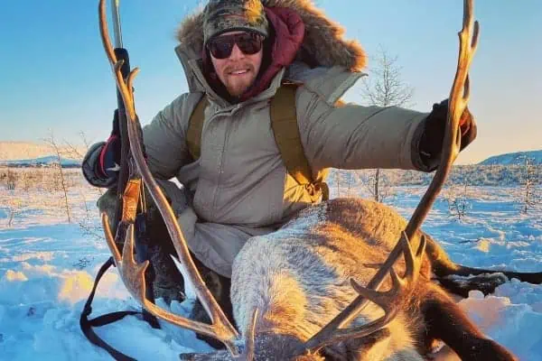 A hunter with a caribou