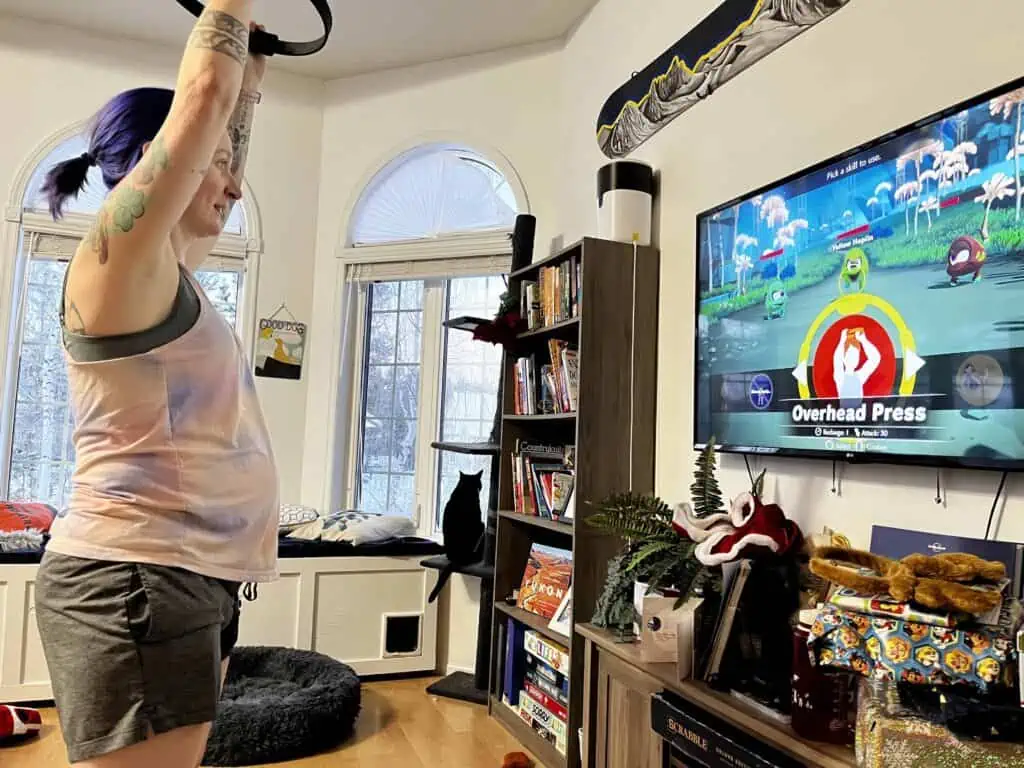 A pregnant woman exercising at home