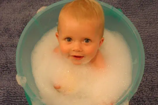 A baby in a wash tub