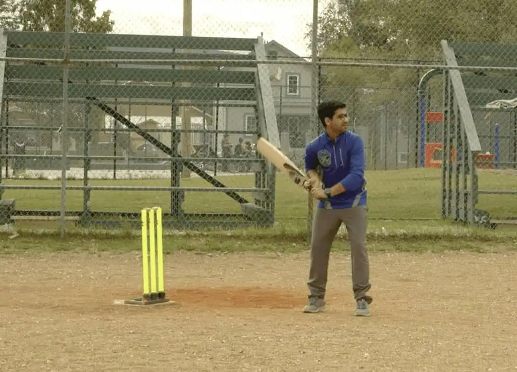 A man  playing cricket