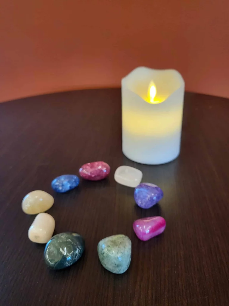 Beautiful stones around a candle visually represent a group having enlightened discussions