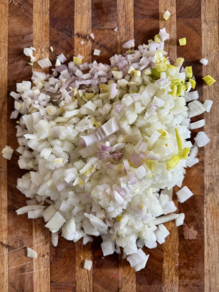 Chopped onions, shallots, and green onions