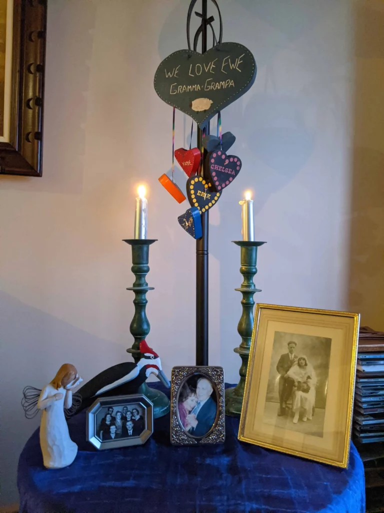Mom's altar, with her grandchildren’s hearts hanging above it